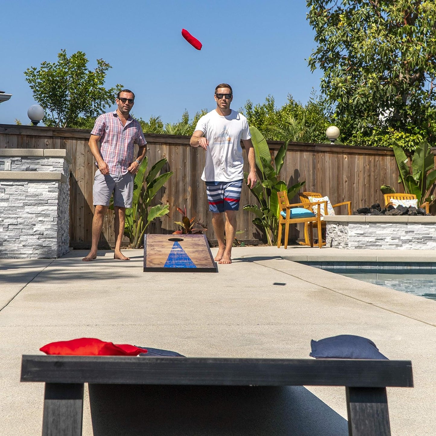 Cornhole game rental being played at an outdoor event