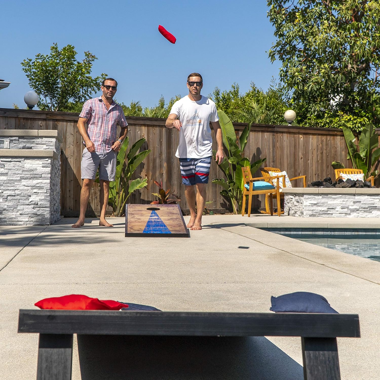 Cornhole game rental being played at an outdoor event